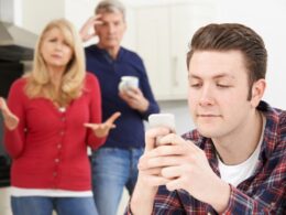A young mand and his parents