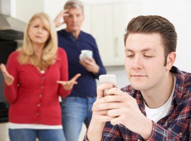 A young mand and his parents