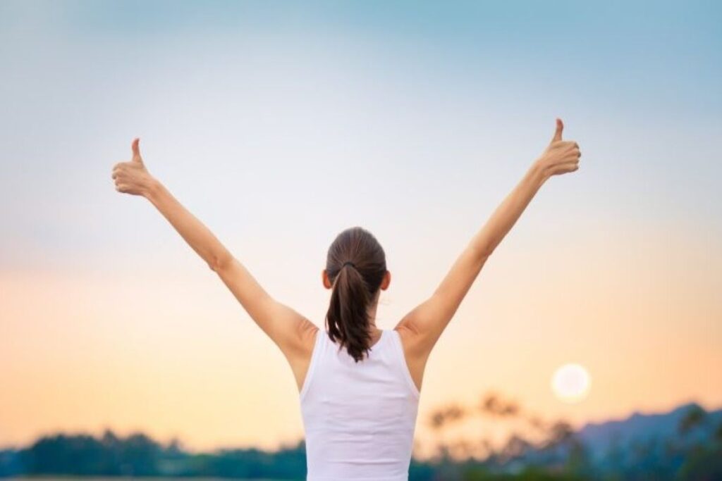 A woman saluting the sun