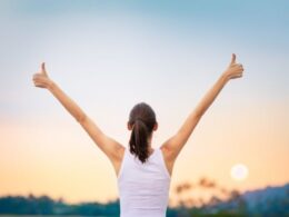 A woman saluting the sun