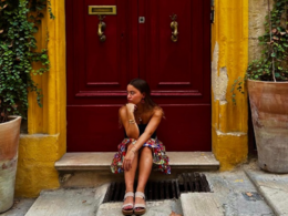 girl sitting on a doorstep