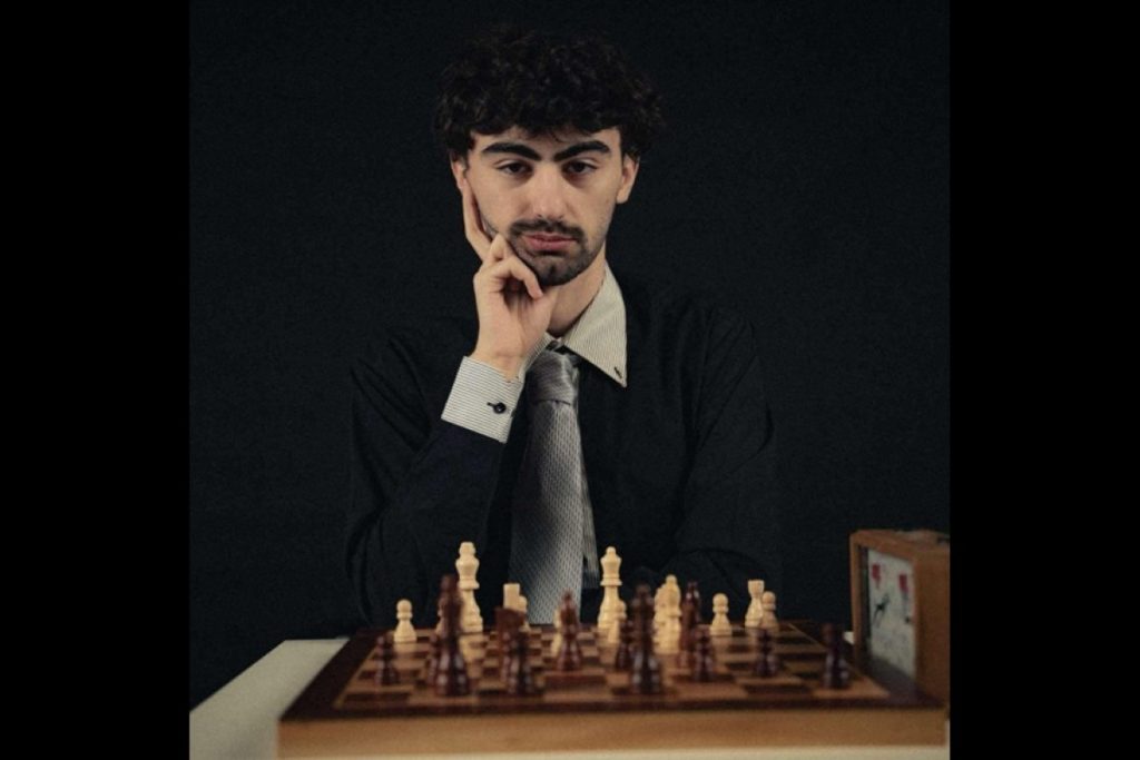 A young man and a chessboard