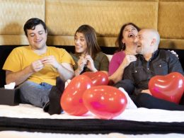 Four people on a bed