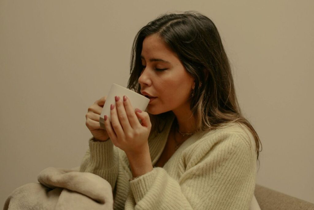 A woman with a hot drink