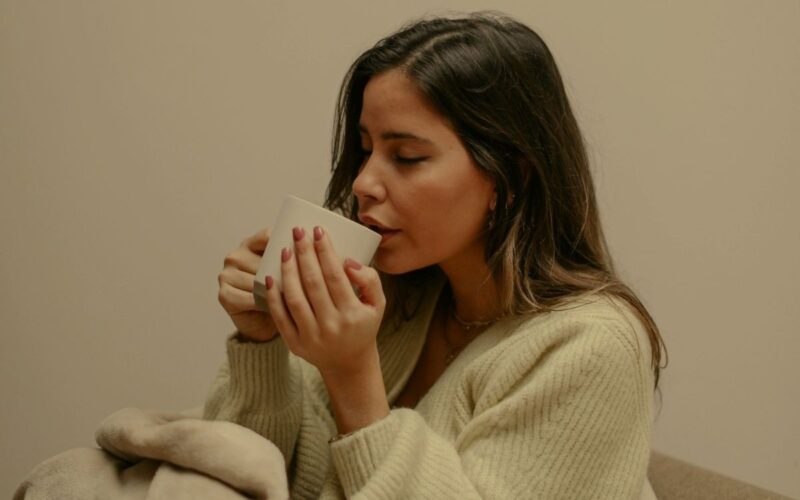 A woman with a hot drink
