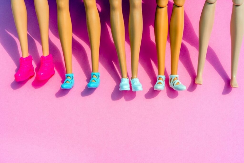 a series of Barbie legs with shoes