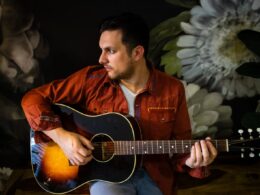 Dean Muscat playing guitar