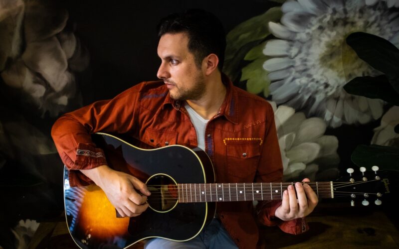 Dean Muscat playing guitar