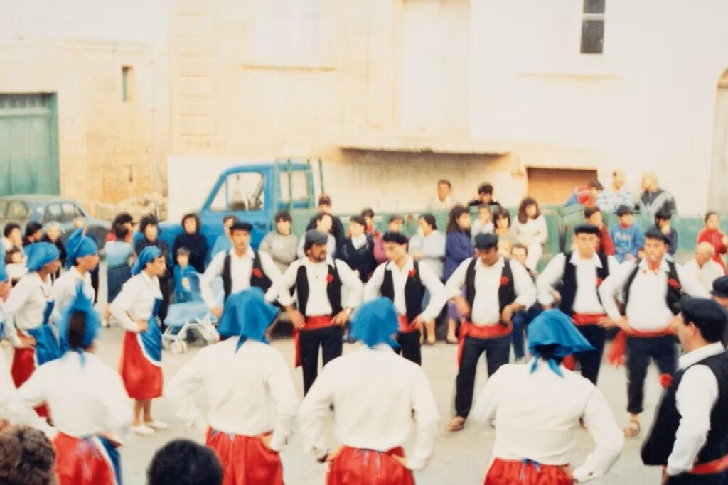 An old fashioned photo of traditional dancers