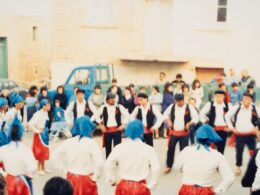 An old fashioned photo of traditional dancers