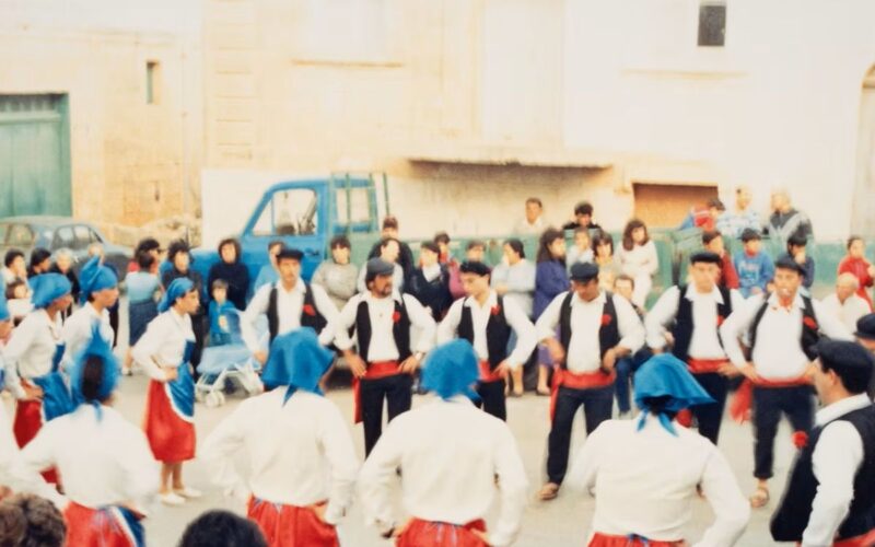 An old fashioned photo of traditional dancers