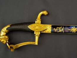 The fancy golden handle of a sword