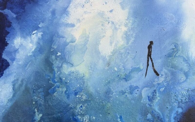 a silhouette of a diver against an abstract blue background