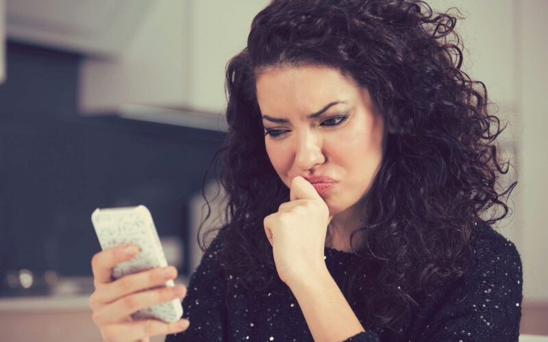 A woman looking at her phone