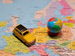 a map with a mini-globe ad car