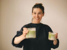 A woman with two glasses of matcha