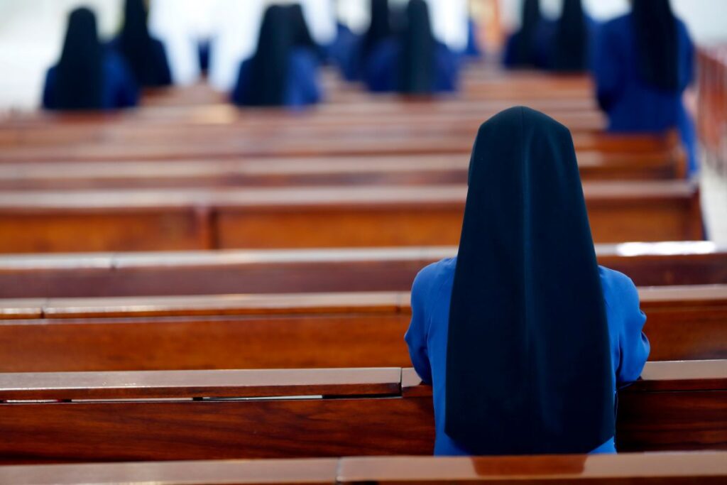 Nuns at prayer in a church