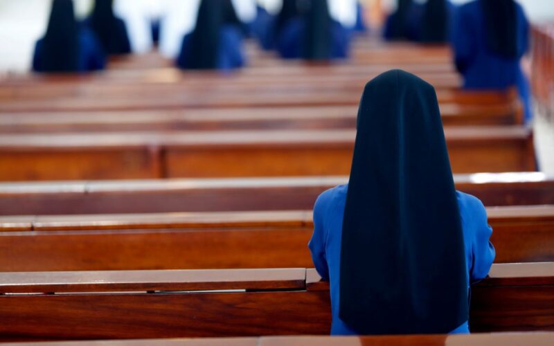 Nuns at prayer in a church