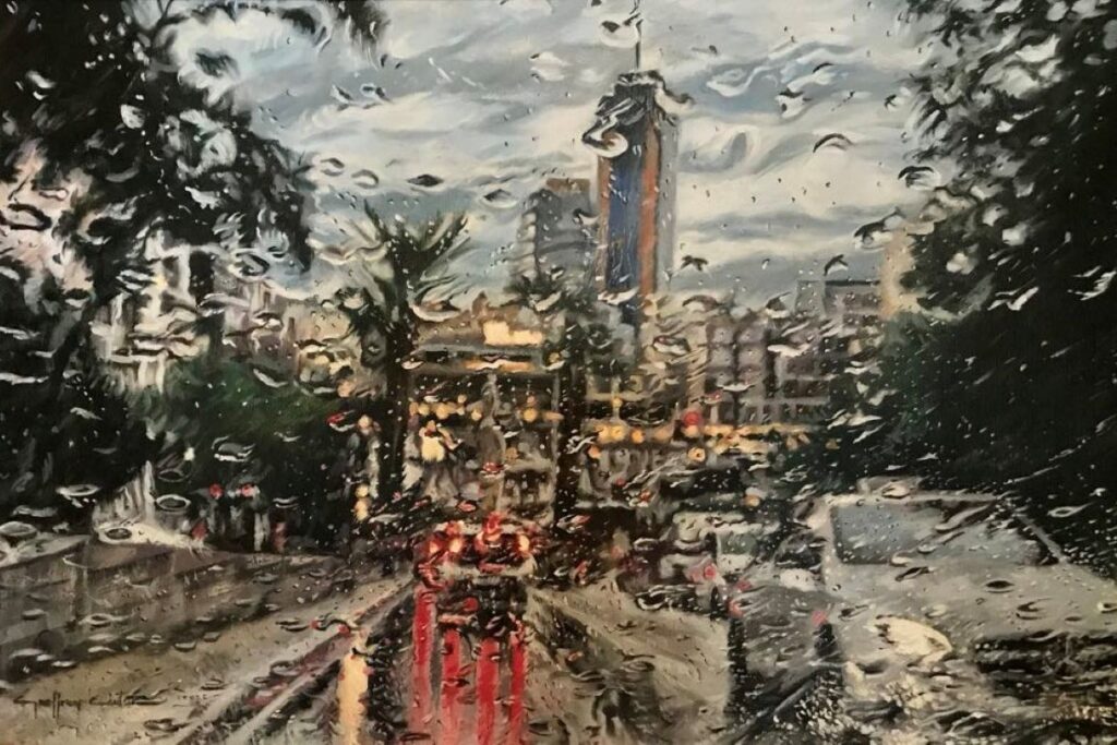 A Maltese streetscene in the rain, seen through a wet windscreen