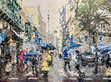 A Maltese streetscene in the rain, seen through a wet windscreen