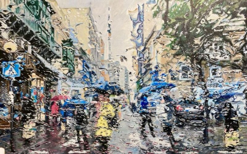A Maltese streetscene in the rain, seen through a wet windscreen