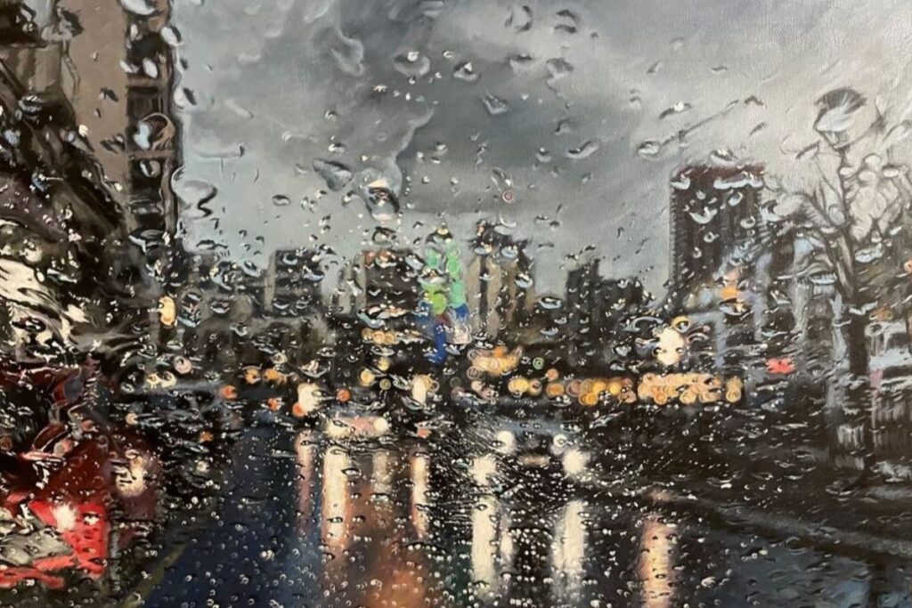 A Maltese streetscene in the rain, seen through a wet windscreen