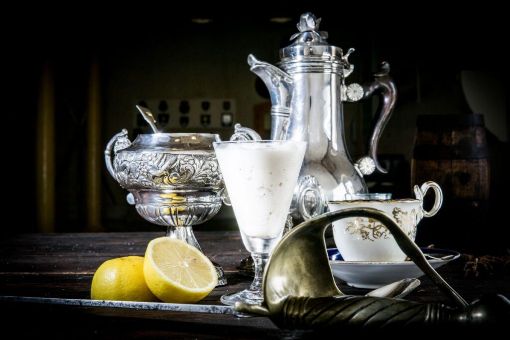 Silver tableware, milk and lemons
