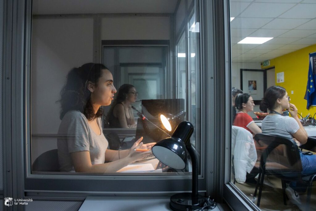 a woman in an interpreting booth