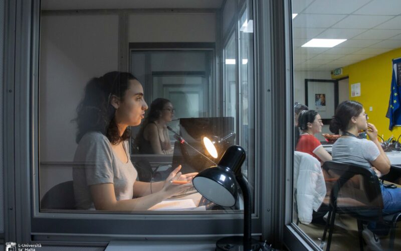 a woman in an interpreting booth