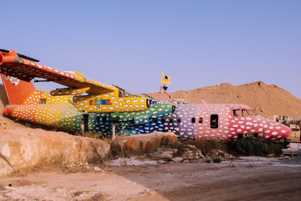 a coloured aeroplane on Maltese rock