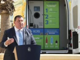 Cleansing junior minister Glenn Bedingfield in front of one of the new mobile BCRS machines