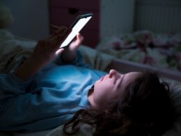 Child looking at mobile phone
