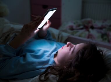 Child looking at mobile phone
