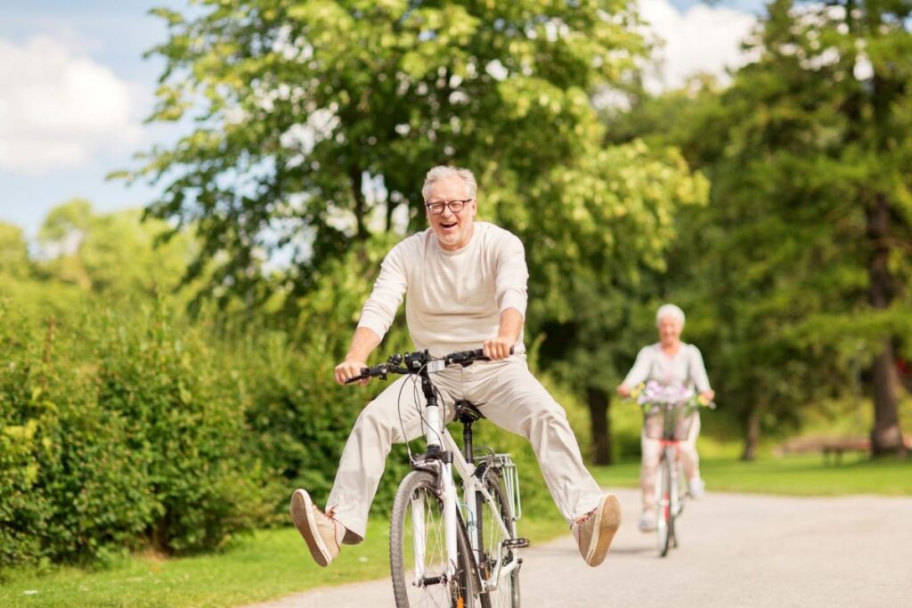 Two mature people on bikes