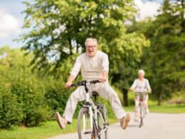 Two mature people on bikes