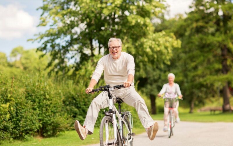 Two mature people on bikes