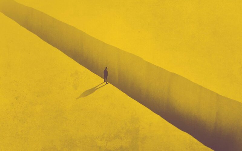 a man on the edge of a chasm in the ground