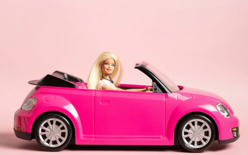 Barbie in a pink car