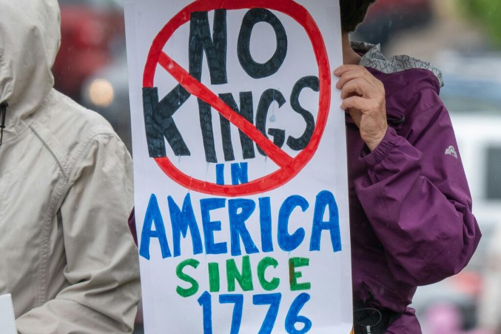 A placard saying No Kings