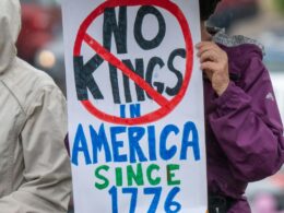 A placard saying No Kings