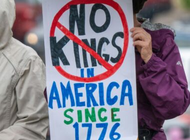 A placard saying No Kings