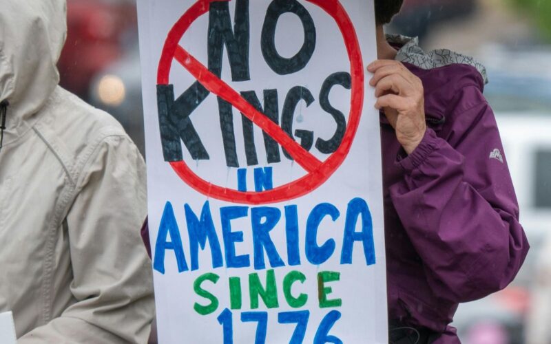 A placard saying No Kings