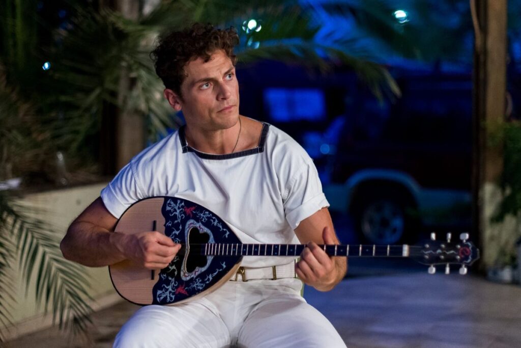 David Tucci with a musical instrument