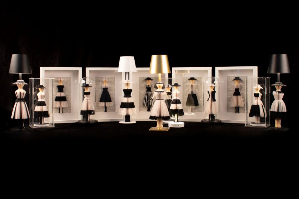paper sculpture of small dresses