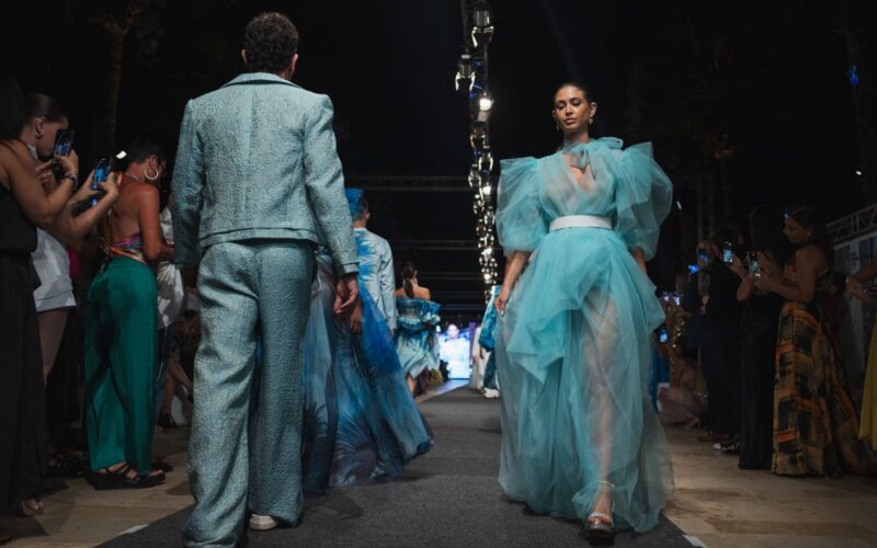 Models wearing outfits from the latest Charles and Ron collection.