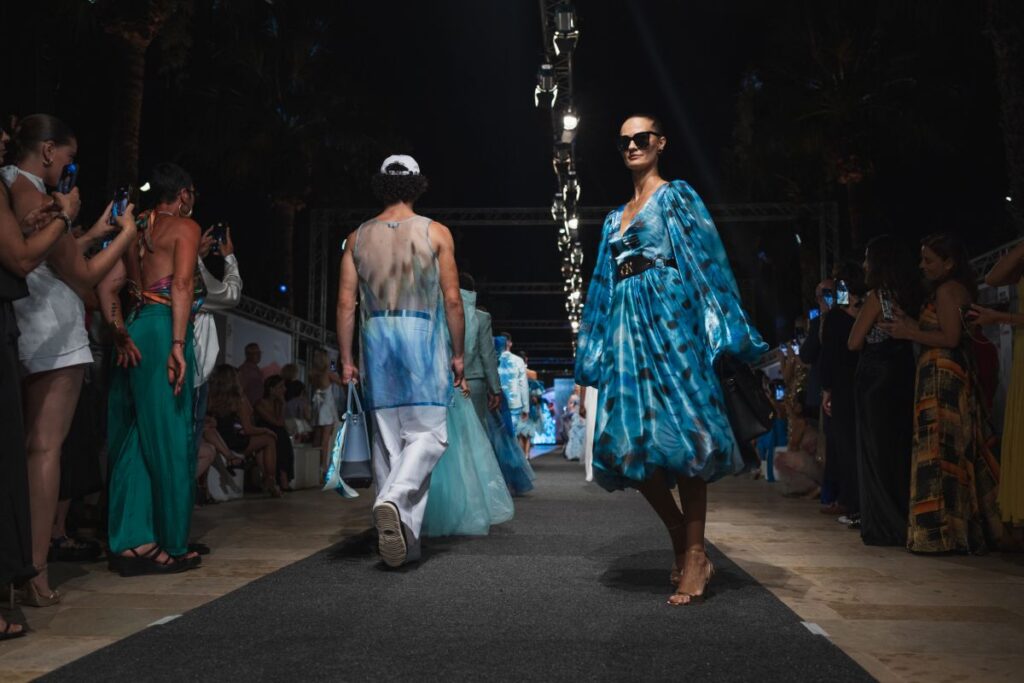 Models wearing outfits from the latest Charles and Ron collection.