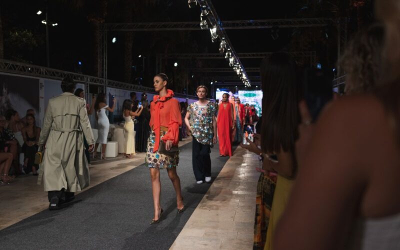Models wearing outfits from the latest Charles and Ron collection.