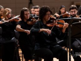 MPO leader Marcelline Agius playing in the orchestra