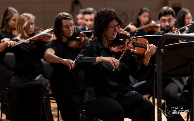MPO leader Marcelline Agius playing in the orchestra