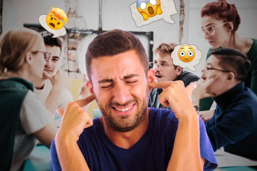 A man with his fingers in his ears